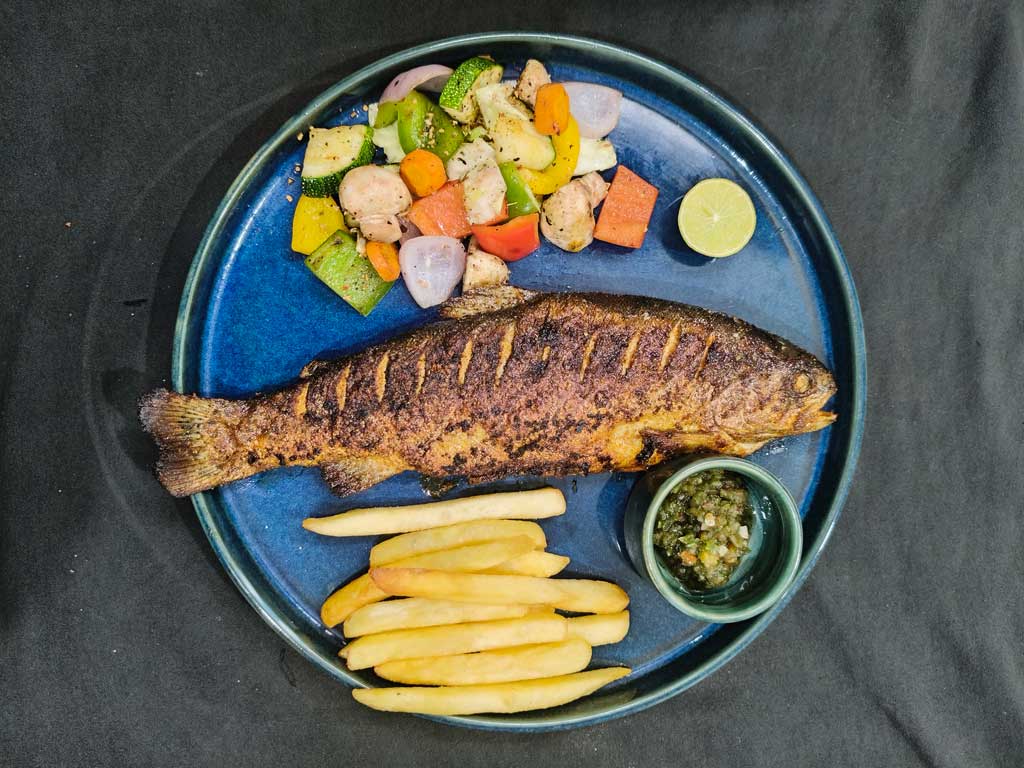 Grilled whole fish with roasted vegetables at Naggarte